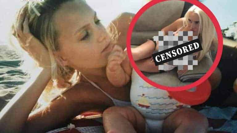 Kobieta na plaży, z nowym wyglądem po operacjach plastycznych, relaksuje się na słońcu.